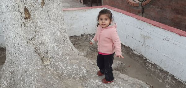 Portrait of cute girl standing outdoors