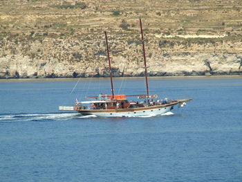 Boats sailing in sea