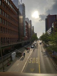 City street and buildings against sky