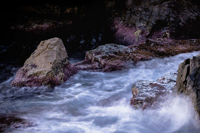 Scenic view of waterfall in sea