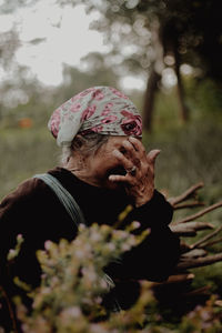 Close-up of young woman looking away