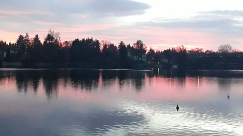 Scenic view of lake against sky during sunset