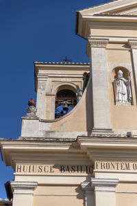 Low angle view of historical building against clear blue sky