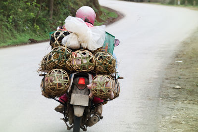 Close up of iconic vietnamese motorbike driver on the road