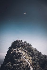 Low angle view of ice on mountain against sky