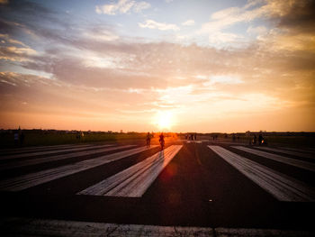 People walking on abandoned runway