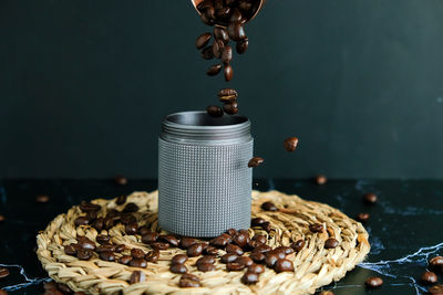 Close-up of coffee beans on table