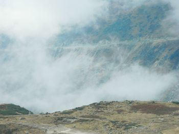 View of clouds over mountain range