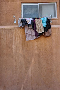 Clothesline on wall in town 