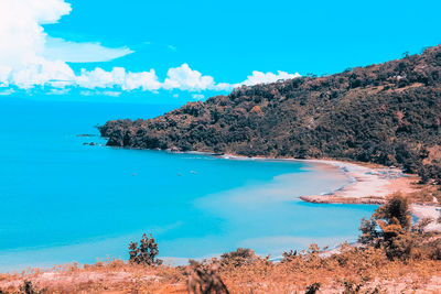 Scenic view of sea against blue sky