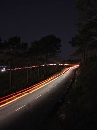 Light trails on road at night