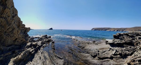 Scenic view of sea against clear blue sky