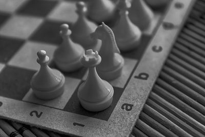 High angle view of chess pieces on table