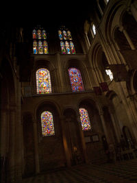 Low angle view of stained glass window in church