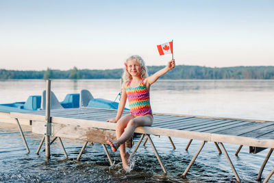 Full length of a woman sitting in water