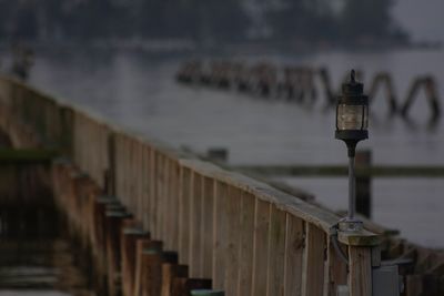 Close-up of railing against sea