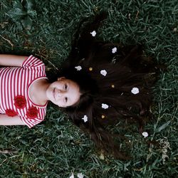 High angle portrait of woman relaxing on field