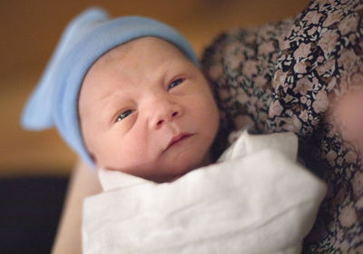 Portrait of cute baby lying down at home