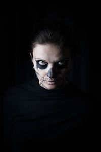 Portrait of woman wearing face paint