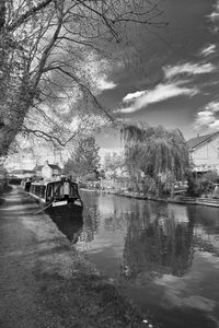 Boats in river with buildings in background