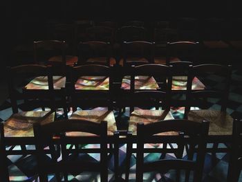 Empty chairs and tables in restaurant