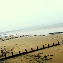 Scenic view of beach against clear sky