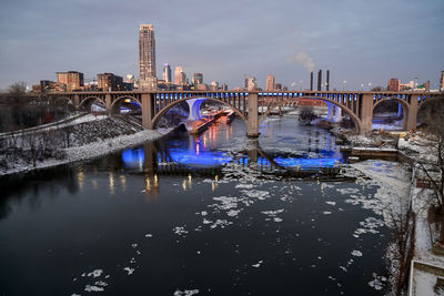 Downtown winter skyline along the river at sunrise