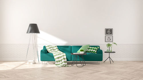 Modern interior of living room with green sofa on wood flooring and white wall .emptry room 