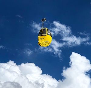 Low angle view of balloons against sky