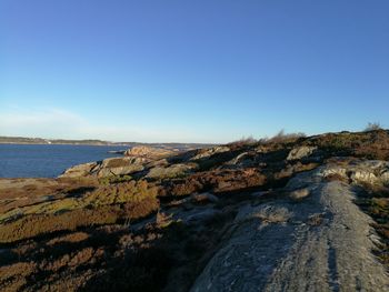 Scenic view of sea against clear blue sky