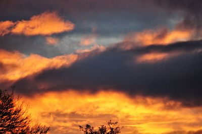 Low angle view of dramatic sky during sunset