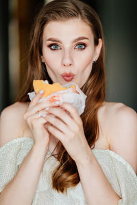 Portrait of woman eating food