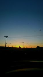 Silhouette landscape against scenic sky