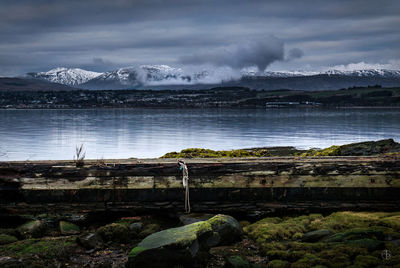 Scenic view of mountains against cloudy sky