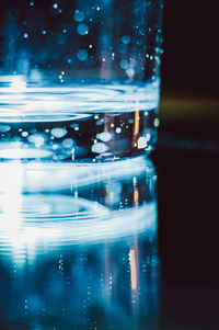 Close-up of wet glass on table