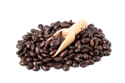 Close-up of coffee beans against white background