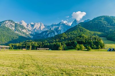 Scenic view of landscape and mountains against sky