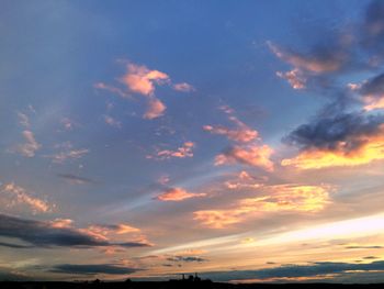 Low angle view of cloudy sky at sunset