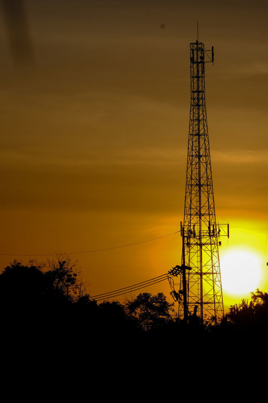 SILHOUETTE OF ELECTRICITY PYLON AGAINST SKY DURING SUNSET