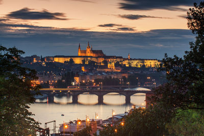 Prague skyline after dark, with prague castle complex,  vltava river and naplavka.
