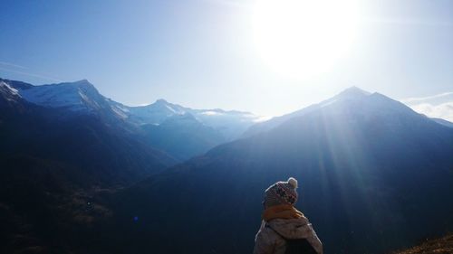 Woman against mountains and sky