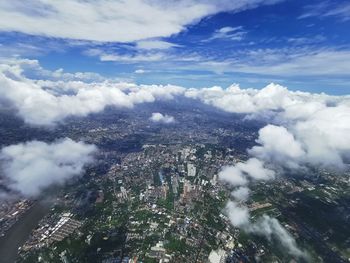 High angle view of buildings in city against sky