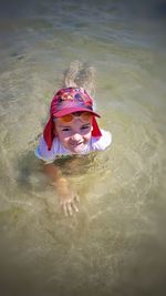 Portrait of cute girl in water