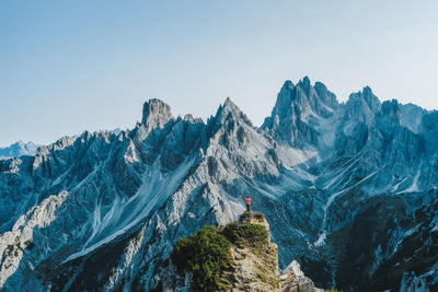 Scenic view of snowcapped mountains against clear sky