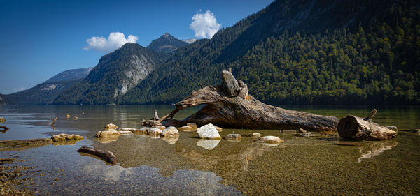 Scenic view of lake and mountains against sky