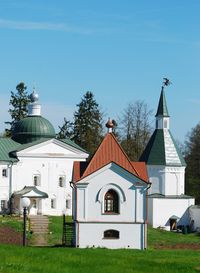 Church by building against sky