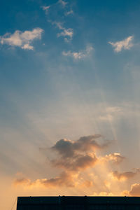 Low angle view of cloudy sky during sunset