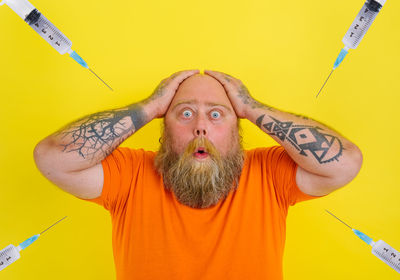 Portrait of man against yellow background