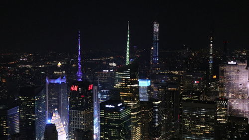 Illuminated buildings in city at night