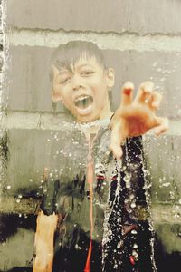 Close-up of boy playing in water